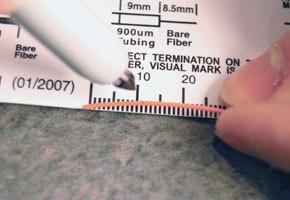 Measure and mark an additional 11 mm on the fiber jacket